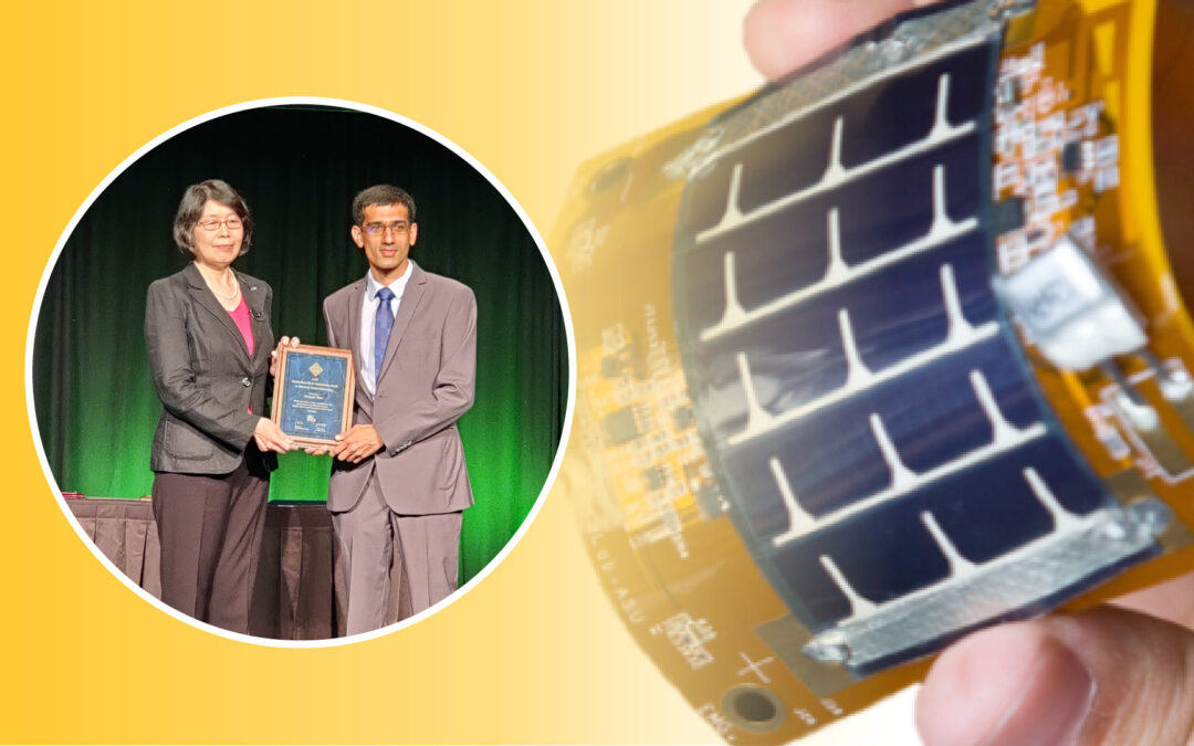 Ganapati Bhat accepts an award while shown holding his prototype flexible medical device