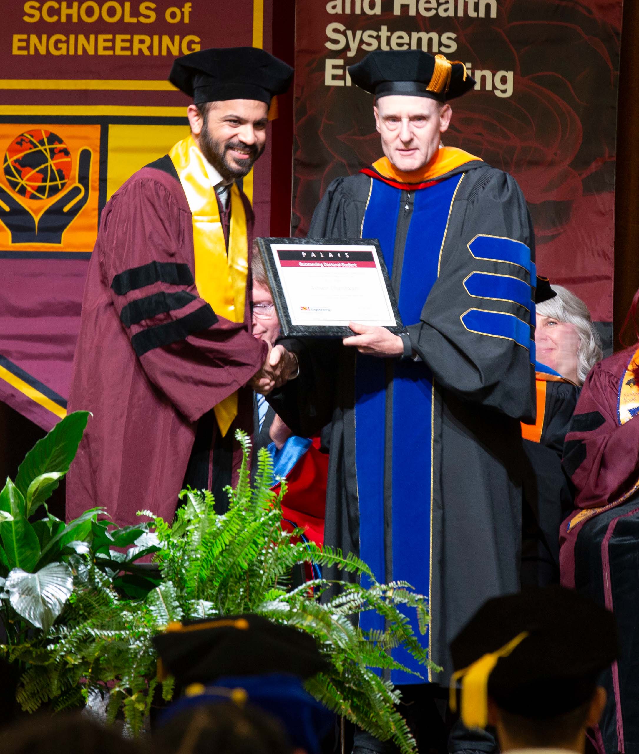 Ashwin Chandwani receives the Palais Outstanding Doctoral Student Award from Stephen Phillips
