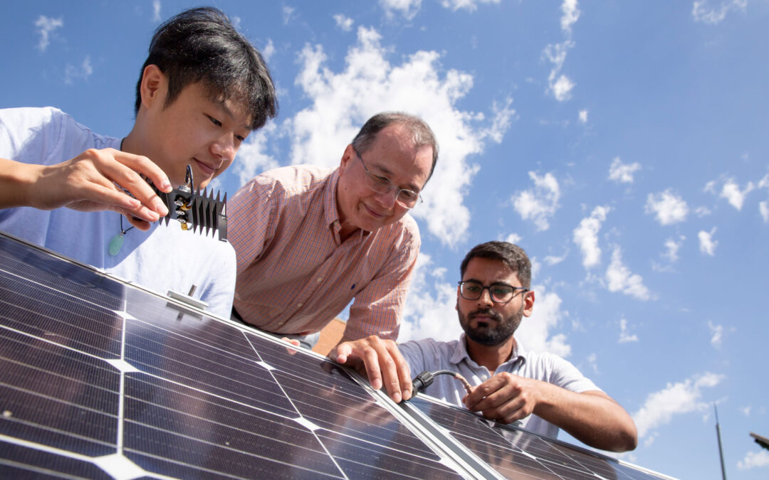 Kevin Tan, an electrical engineering graduate student, Meng Tao, a professor of electrical engineering in the Ira A. Fulton Schools of Engineering at Arizona State University, and Muhammad Tayyab Zubair, an electrical engineering graduate student, discuss the structural components of solar panels.