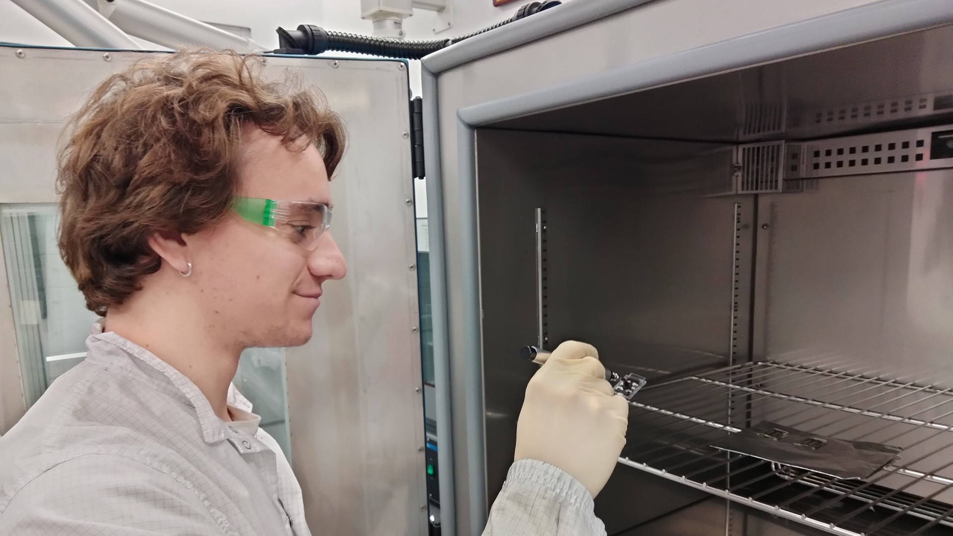 A student researcher tests a piece of perovskite material