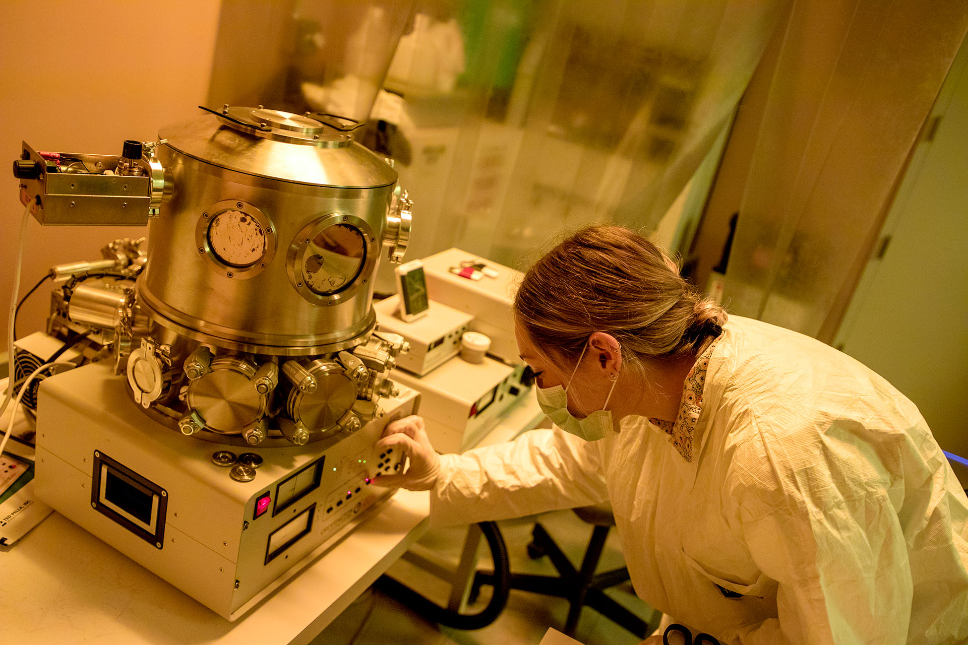 A researcher works with equipment in a lab