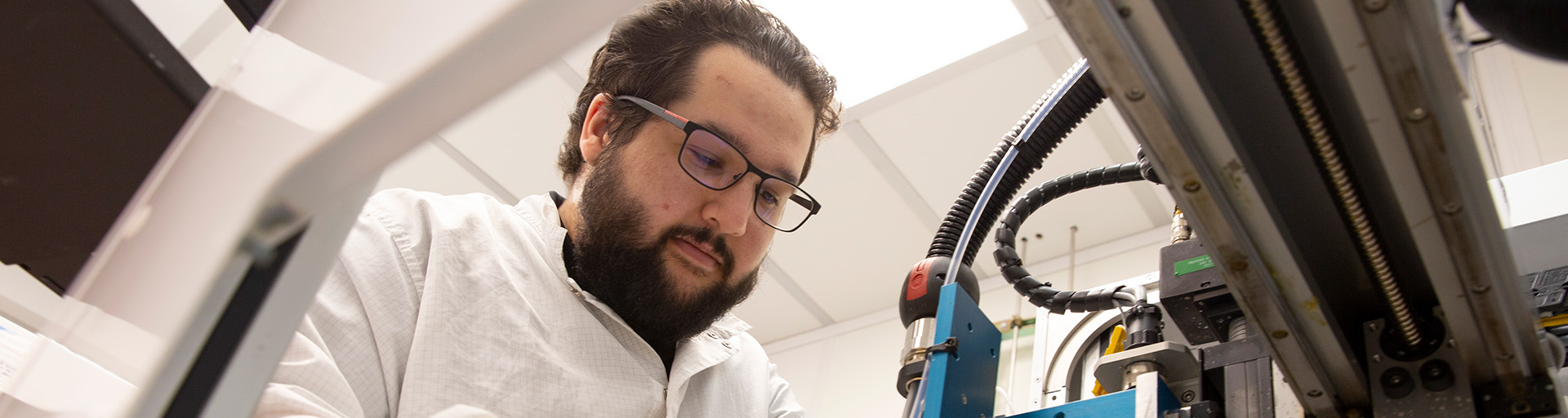 A man works with equipment in a laboratory